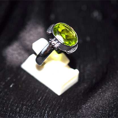 925 Sterling Silver Oval Faceted Peridot Ring with Ornate Setting