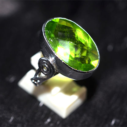 925 Sterling Silver Oval Faceted Peridot Ring with Scroll Motif Shank